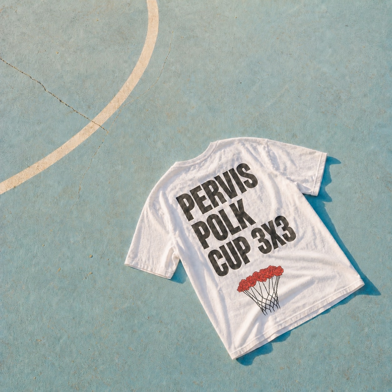Pervis Polk Cup T-shirt with a rose basketball net logo on a sunlit outdoor court